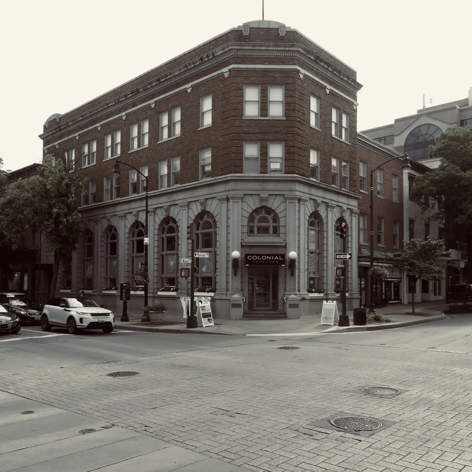 Muted-tone corner view of the historic Colonial Jewelers building at West Patrick and South Market streets