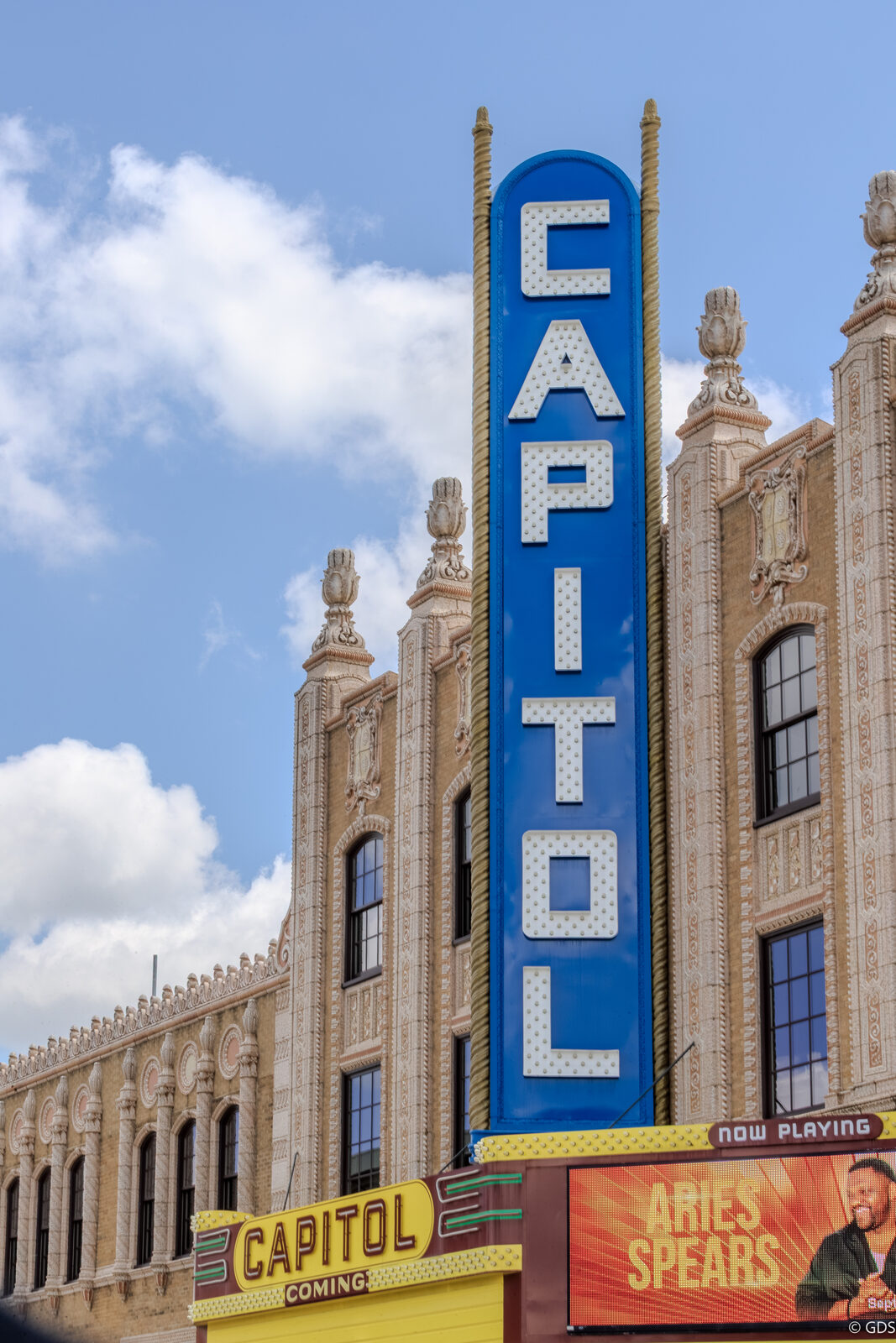 The Capitol Theatre's vertical marquee rising over its ornate façade in downtown Flint