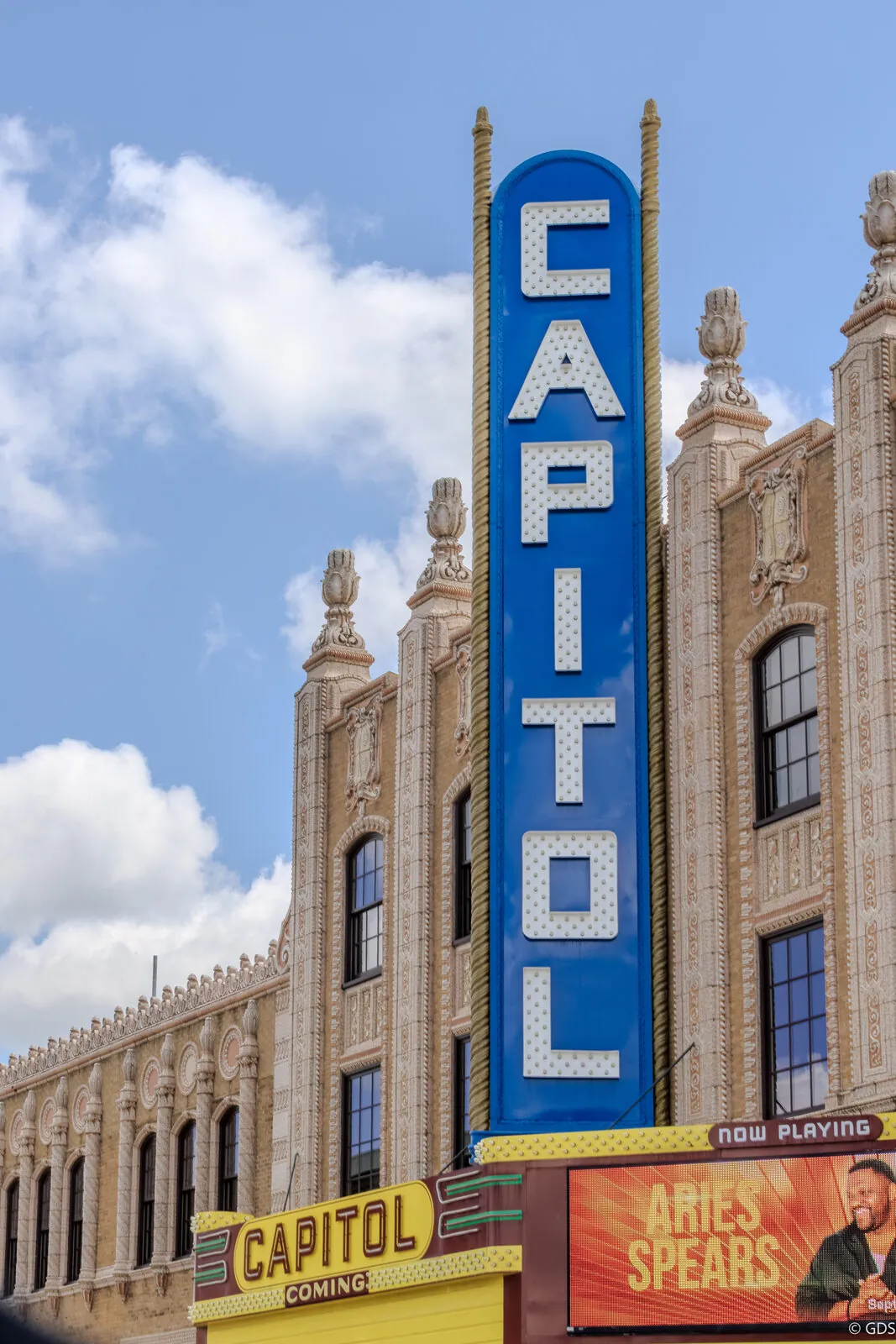 The Capitol Theatre's vertical marquee rising over its ornate façade in downtown Flint