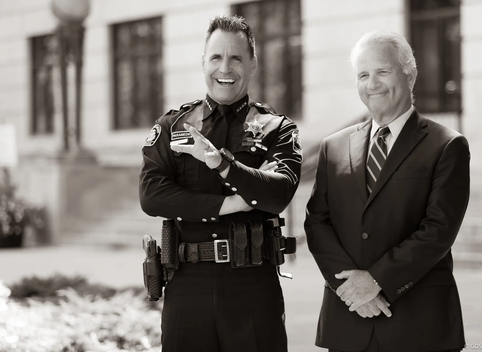 Sheriff Chris Swanson and a candidate outside the county courthouse during a campaign ad shoot