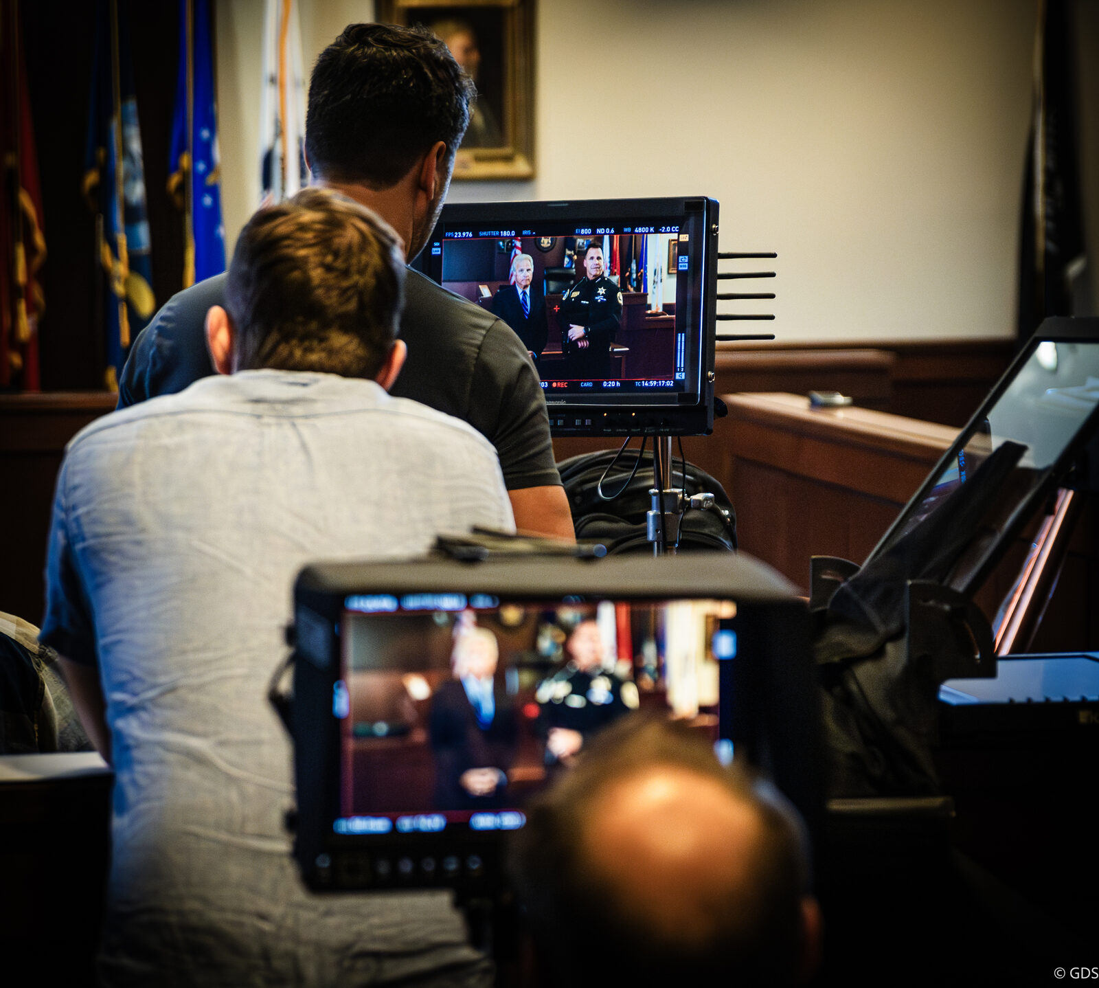 Behind the scenes of a campaign ad shoot — the crew at the monitors