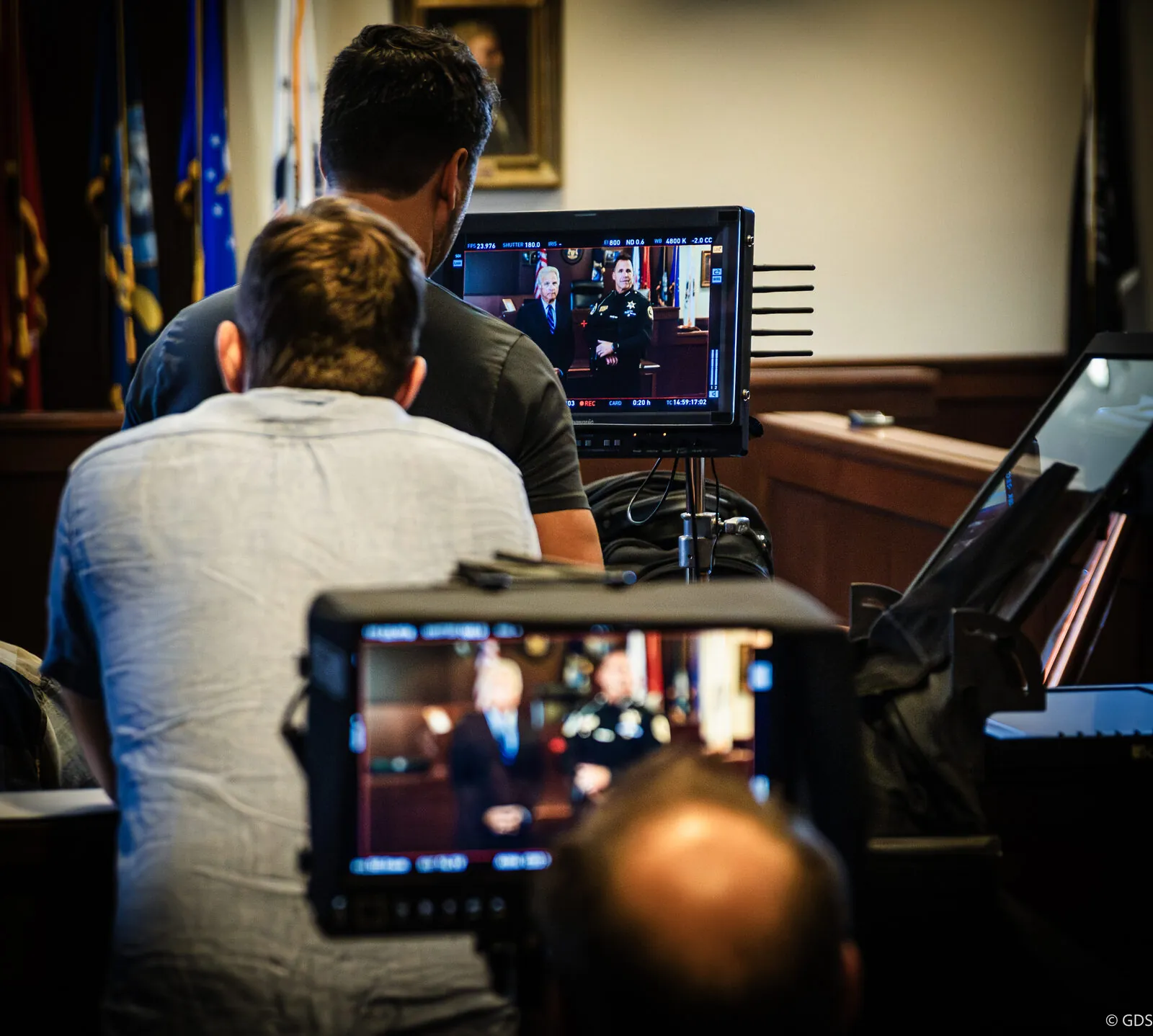 Behind the scenes of a campaign ad shoot — the crew at the monitors