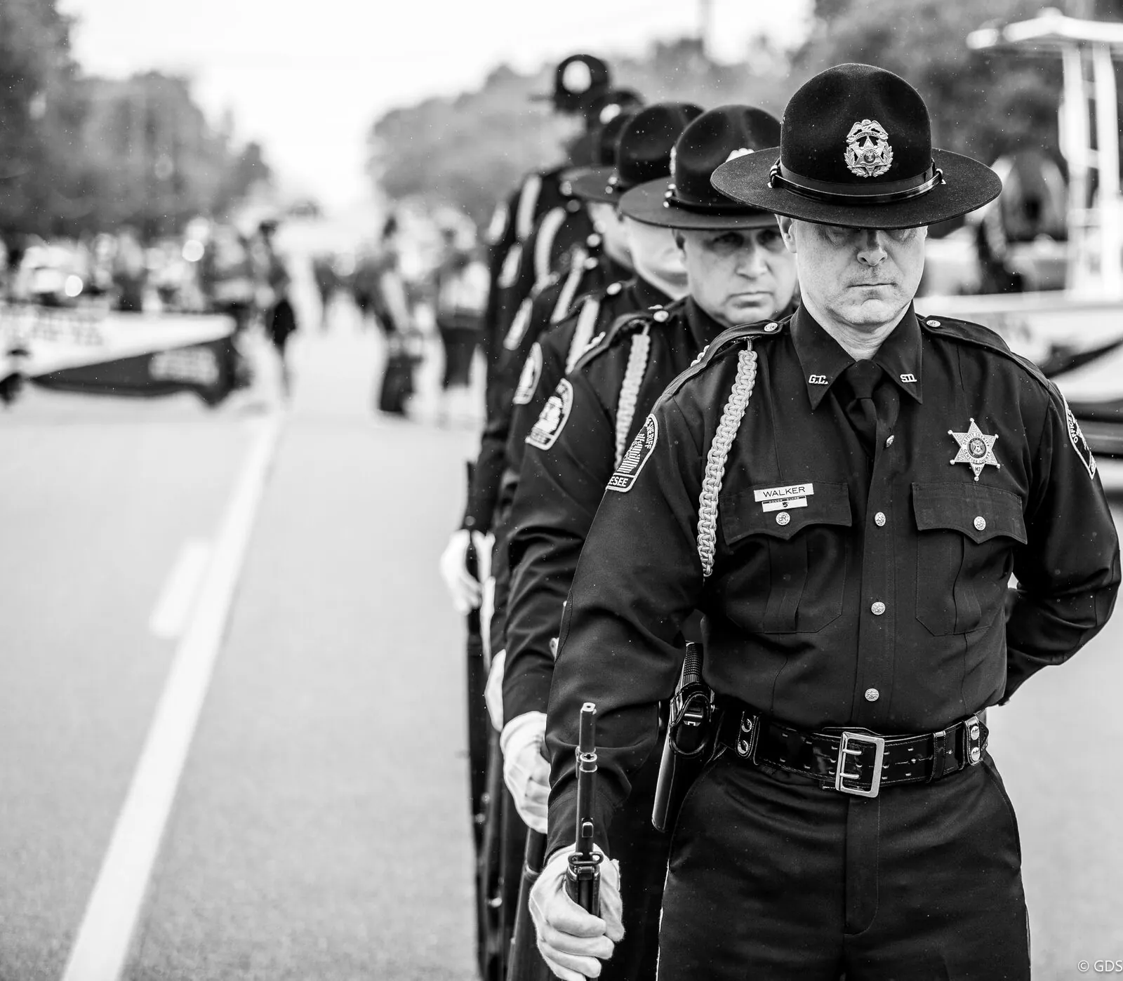 A sheriff's honor guard marching in the Burton parade