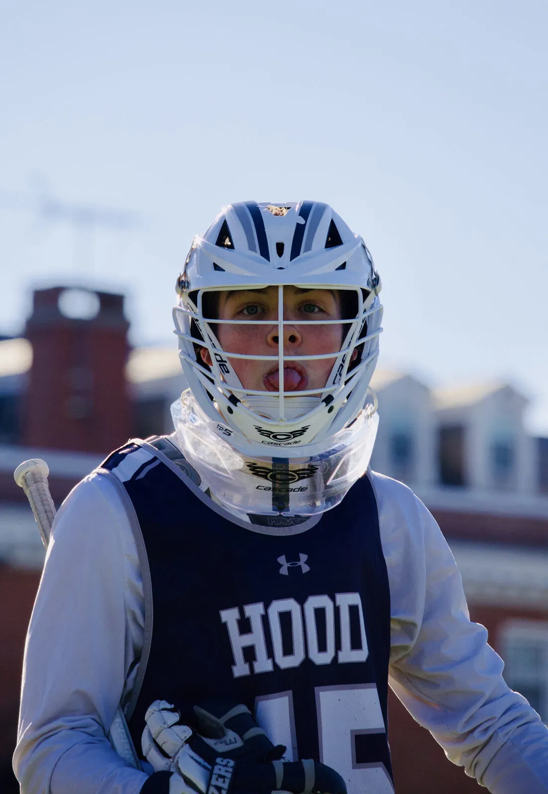 College lacrosse — a Hood College player focused inside his helmet before the whistle